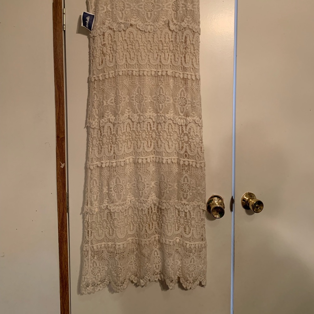 Off-white ankle length lace skirt. Never worn.